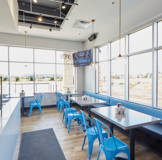 The warm dining room at Little Gyros Greek Grill